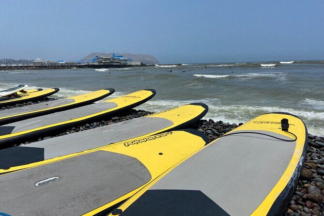 Beginner Surf Lesson in Lima, Perú - The sea session: how instructors help you stand and stay safe