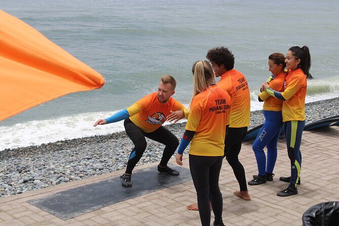 Beginner Surf Lesson in Lima, Perú - All the gear you get: wetsuit, aqua shoes, and a learning board