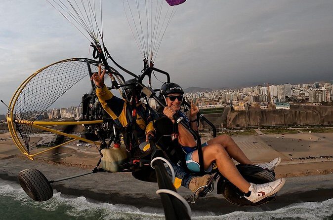 Fly paragliding along the coast of Lima - Safety Gear and Insurance: What You’re Being Provided