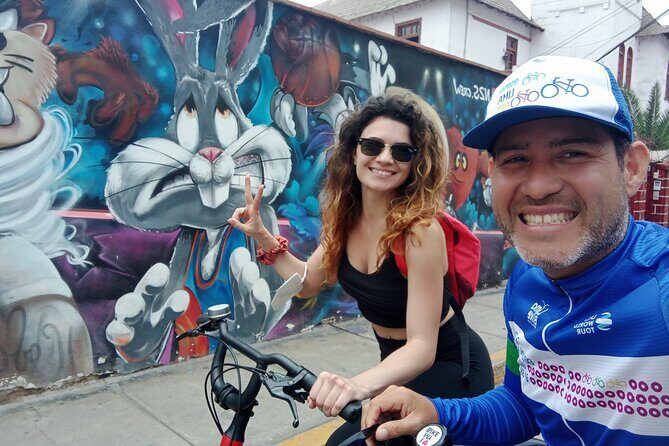 Lima Coastal Bike Tour to Morro Solar & Jesus Statue Viewpoint - Wooden bridge, murals, and the first taste of Lima by bike