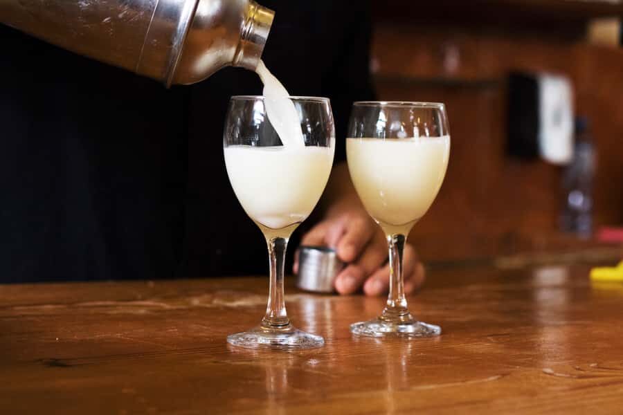 Lima: Flavors and Tradition Walking Tour with Food Tasting - San Francisco church churros and Cordano Tavern pisco sour finish