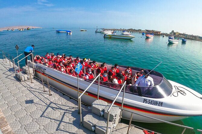 Tour to Paracas and Huacachina in one day - Huacachina Oasis: walking, photos, and free-time boating